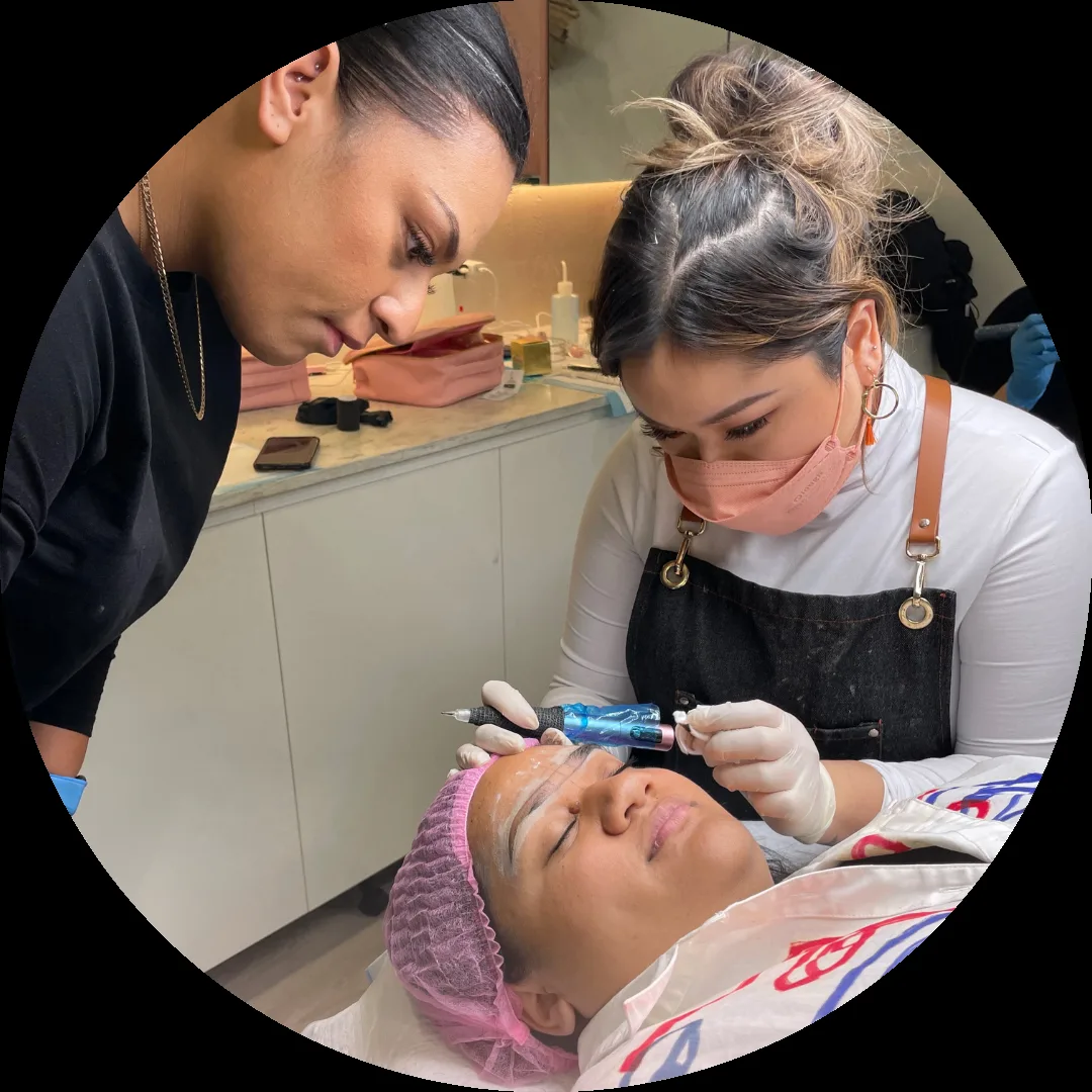 Artists performing brow procedure