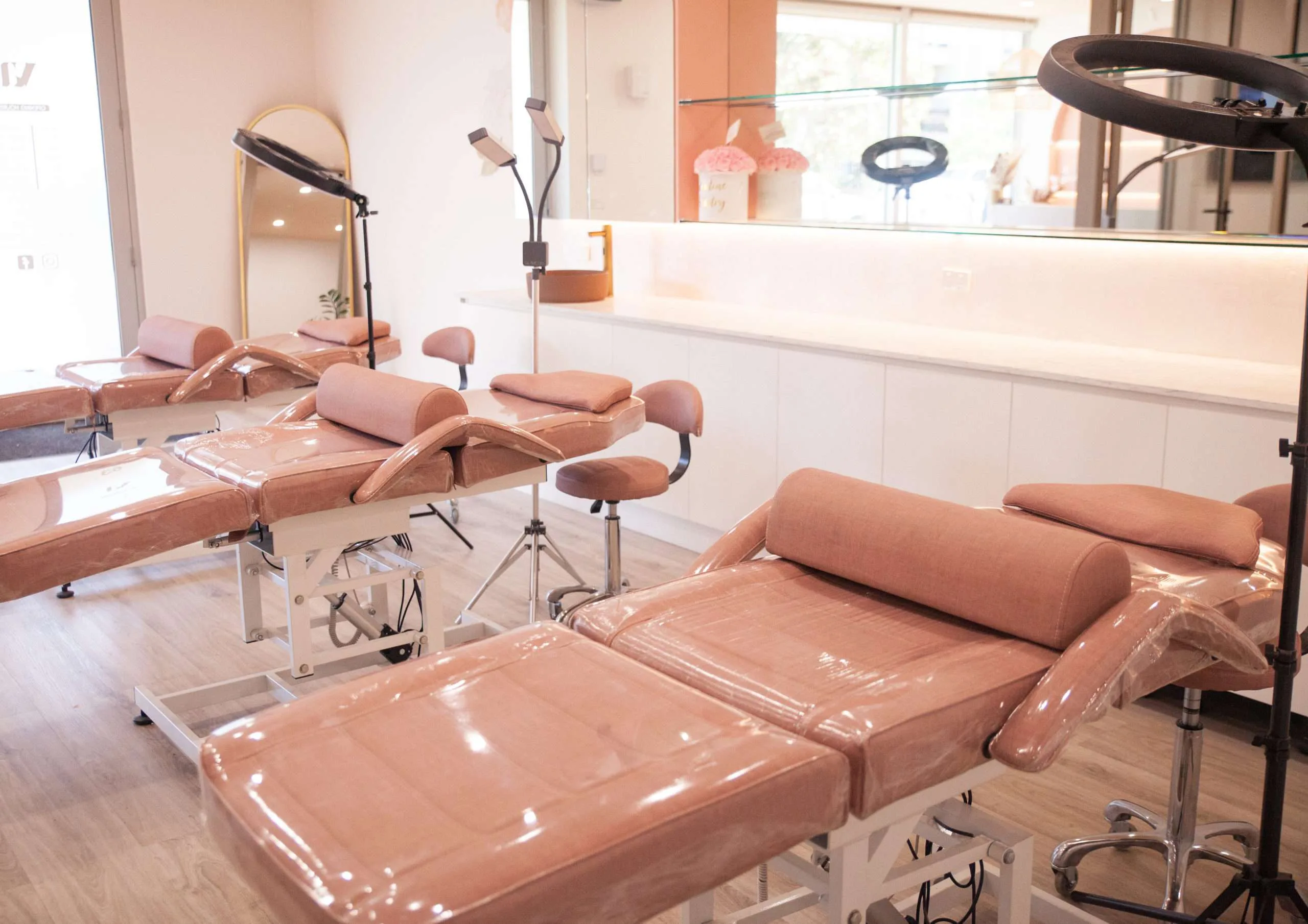 Treatment room with blush beds and ring lights